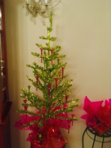 Styling a lime green tinsel feather tree with hot pink fuschia ornaments