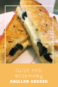 This olive and rosemary grilled cheese combines tradiitional Mediterranean flavors in a gooey grilled cheese. Grilled cheese grows up!